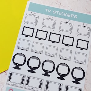 May include: A sheet of black and white TV stickers. The stickers feature various sizes and shapes of televisions, including a retro style television with an antenna. The sheet is labeled "TV STICKERS".