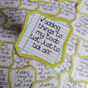 May include: A sticker featuring a notepad design with the text "Adding things to my to-do list. Just to tick off." The sticker has a yellow border and a holographic silver outline. The background is filled with similar stickers.
