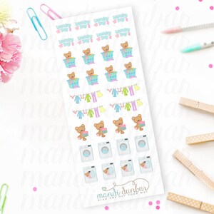 May include: A sheet of laundry day planner stickers with various designs, including teddy bears in laundry baskets, clothes on a clothesline, and washing machines. The stickers are in pastel colors. The text "Laundry Day" is at the top.