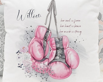 May include: White cushion with pink boxing gloves and floral accents. The text "Willow" and "her soul is fierce, her heart is brave, her mind is strong" is printed on the cushion.