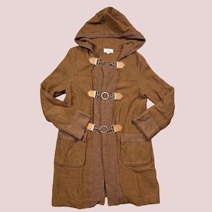 May include: A brown hooded coat with toggle closures and two front pockets. The coat features a ribbed knit trim on the cuffs and a contrasting knit panel down the front. The toggle closures are made of metal and leather.