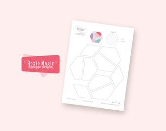 May include: A white paper with geometric shapes and the text "Hexie Magic" in a pink banner. The paper features a design for English paper piecing, with various hexagon shapes and a color guide.