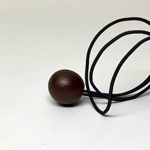 Hair Tie Lasso - Ball - Brown - has very thick elastic.  Step up your Loc Game!  It can be worn as a hair tie or bracelet.  Check it out!
