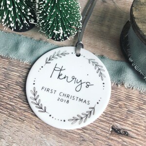Personalised Baby’s First Christmas Monochrome Wreath Ceramic Round Decoration Ornament Keepsake