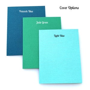 May include: Three paper samples in different colors: peacock blue, jade green, and light blue. The text "Cover Options" is visible at the top of the image.