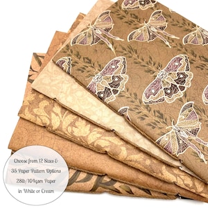 May include: A stack of decorative paper sheets in various shades of brown and cream. The top sheet features a repeating pattern of moths and foliage. The image includes the text: "Choose from 12 Sizes & 35 Paper Pattern Options 28lb/104gsm Paper in White or Cream."