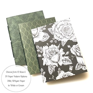 May include: Three notebooks with different covers. The first two covers are green with a geometric pattern. The third cover is black with a white floral pattern. The text on the bottom reads: "Choose from 12 Sizes & 24 Paper Pattern Options 28lb/104gsm Paper in White or Cream".