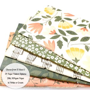 May include: A stack of five different patterned paper notebooks with a white background and green, orange, and yellow floral designs. The text on the bottom reads "Choose from 12 Sizes & 24 Paper Pattern Options 28lb/104gsm Paper in White or Cream".