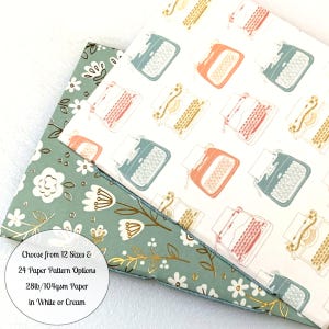 May include: Three paper samples with different patterns. One has a floral design in green and gold. The other two have a typewriter pattern in various colors on a white background. The text on the image says "Choose from 12 Sizes & 24 Paper Pattern Options 28lb/104gsm Paper in White or Cream."
