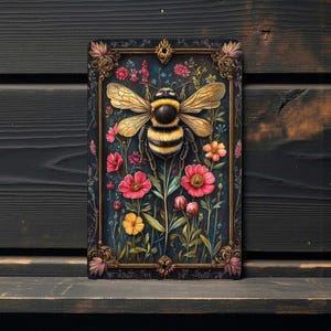 This 8x12 inch metal wall sign features a large bumblebee surrounded by colorful garden flowers with a dark decorative border. The design has a vintage botanical look with pink, yellow, and red flowers against a deep background. The image is a flat digital print on a smooth aluminum surface, not raised, textured, embossed, or 3D.