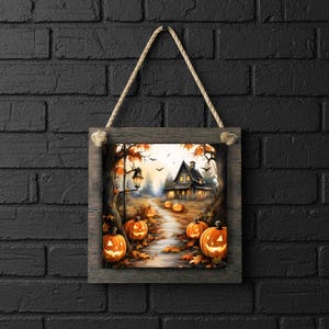 May include: A framed Halloween-themed artwork featuring a spooky house on a path lined with glowing jack-o'-lanterns. The artwork is set in a forest with autumn foliage and a vintage lamp post. The frame is made of wood and is suspended by a rope.