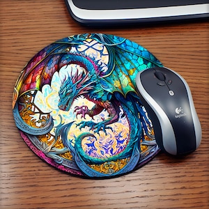May include: Round mousepad featuring a colorful dragon design with shades of blue, green, red, and yellow. The dragon is the central focus, with intricate details and a stained-glass effect. A black and silver Logitech mouse sits to the right.