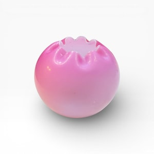 May include: A round, pink glass vase with a ruffled rim. The vase has a gradient effect, transitioning from a darker pink at the top to a lighter pink at the bottom. The vase is a decorative item.