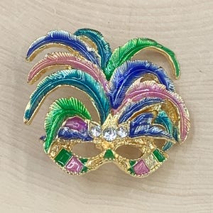 Enamel and rhinestone Mardi gras mask brooch