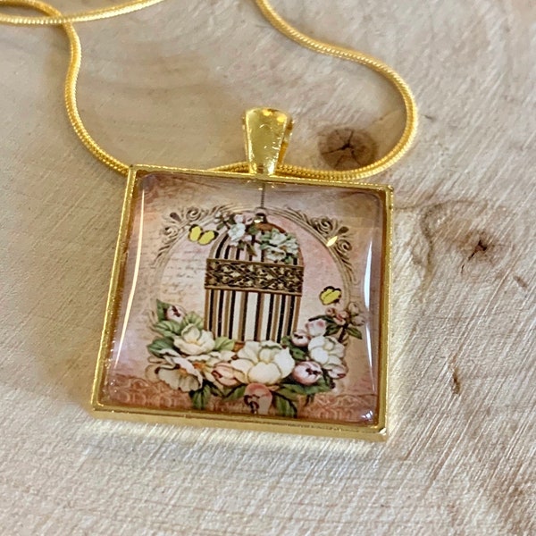 Birdcage pendant on gold tone chain