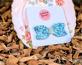 Lazo de purpurina azul y blanca