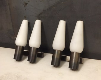 Mid century, pair of brass and triplex opaline glass sconces by Stilnovo