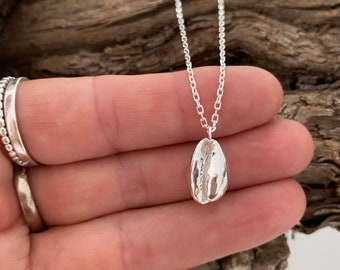 Silver cowrie shell necklace, silver cowrie pendant, silver shell necklace.