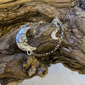 Celestial jewellery. Crescent moon silver bracelet, with little moon dangle.