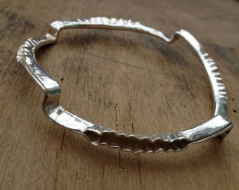 Unusual silver folded bangle, handmade.
