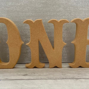 Wooden number one and matching 1/2 set. Free-standing distressed