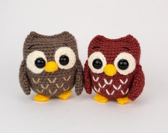 May include: Two crocheted owl toys, one brown and one red, with white accents and large black eyes.