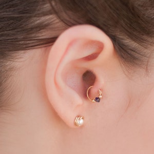 An Indigo colored Swarovski Crystal Cartilage Piercing, Silver / Gold Filled Tragus, Nose Ring, Helix , Rook, Daith, graduation gift