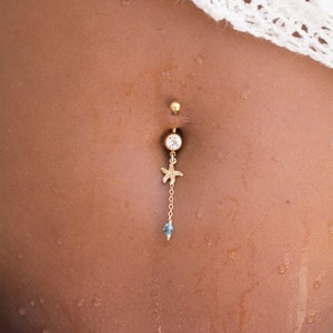 Piercing per ombelico con stella marina riempita in oro 14K e una perla di cristallo Swarovski azzurro, i gioielli per il corpo di cui hai bisogno quest'estate immagine 2