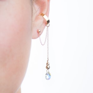 This minimalist clear faceted pear shaped Swarovski crystal prism, 14K Gold Filled dandling ear cuff earring, the perfect wedding jewelry