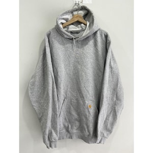 May include: A grey hooded sweatshirt with a front pocket and a small yellow Carhartt logo on the pocket.