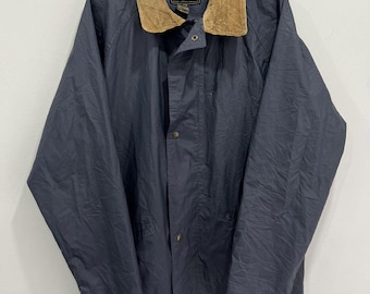 Jaqueta impermeável vintage Eddie Bauer em polivinil com zíper.