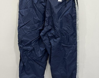 Vintage Nike träningsbyxor med swoosh-mönster, xxl