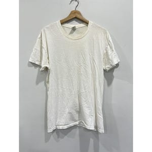 Camiseta vintage blanca con una sola costura