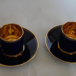 Set of two saucers and coffee cups in porcelain and gold
