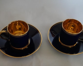 Set of two saucers and coffee cups in porcelain and gold