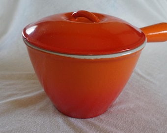Le Creuset - Grande casserole ovale avec couvercle-orange - Catawiki