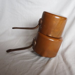 Set of 2 French vintage tinned copper saucepans with spout , 1950s