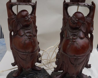 Large vintage pair Buddha laughing wooden statues . Two Asian carved wooden  statues