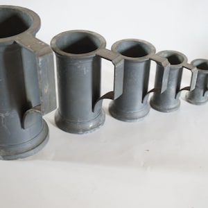 Set of 6 pewter measures, 1900s