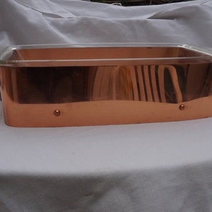 A Dish With Its Copper Support for the service
