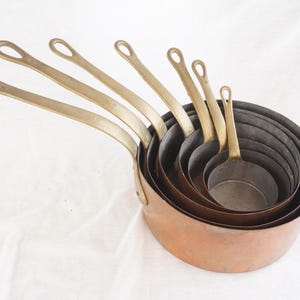 Set of 7 French vintage copper saucepans, 1960s