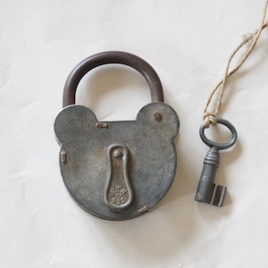 Vintage  steel lock with its original key, 1930s
