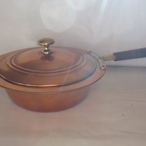 Vintage copper saucepan with lid