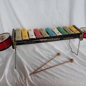 Old metal children&#39;s xylophone toy with two drums