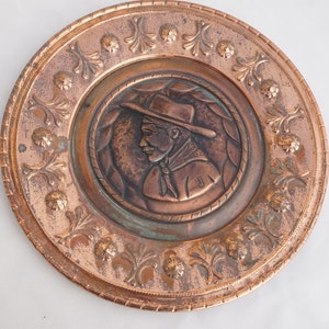 Decorative copper plate represanting a Cowboy