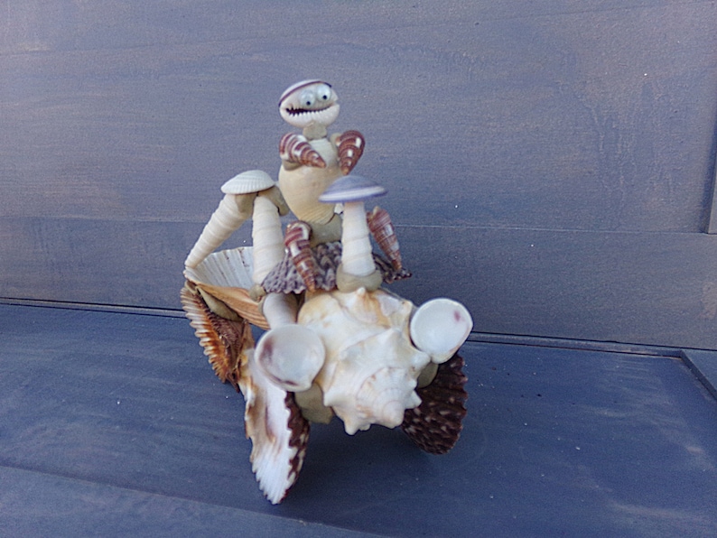 Repaired Excellent Condition Shell Craft Sea Shell ATV And Driver 6 12Inches By 3 Inches By 5 Inches Unusual Collectible Figurine