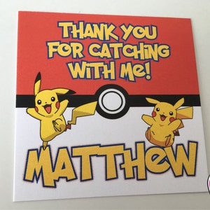 May include: A red and white thank you card with a yellow Pikachu character on each side. The card says "Thank you for catching with me!" and "Matthew".