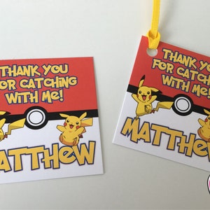 May include: Two red and white thank you cards featuring a yellow Pikachu character. The text on the cards reads "Thank you for catching with me!" and "Matthew".