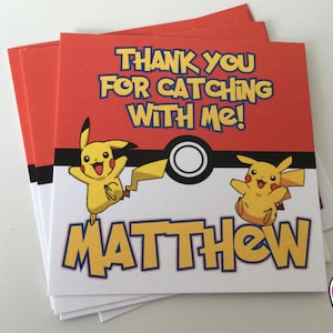May include: Thank you for catching with me! Red and white thank you card featuring a yellow Pikachu character. The card has the name Matthew printed on it.