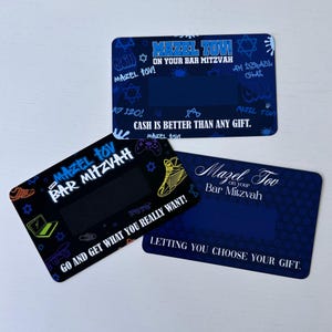 May include: Three blue and black cards with a black scratch-off area. The cards have a blue and black background with a variety of graphics including stars, a game controller, a skateboard, and a sneaker. The text on the cards reads "Mazel Tov on your Bar Mitzvah", "Cash is better than any gift", and "Go and get what you really want!" and "Letting you choose your gift."